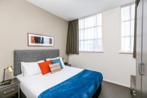 Кровать или кровати в номере Quest New Plymouth Serviced Apartments