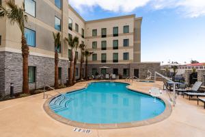 a swimming pool in front of a hotel at Staybridge Suites - Temecula - Wine Country, an IHG Hotel in Temecula
