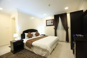Μια τηλεόραση ή/και κέντρο ψυχαγωγίας στο Al Eairy Serviced Apartments Dammam 3
