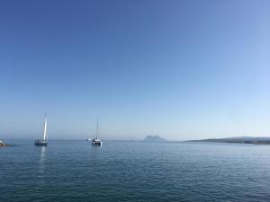 a large body of water with boats in it at Marbella Deluxe Rooms in Royal Cabopino Townhouse in Marbella
