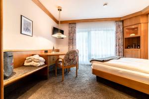 Postel nebo postele na pokoji v ubytování Hotel Restaurant Waldsägmühle