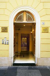 an entrance to a building with an archway at Hotel Meridiana in Rome