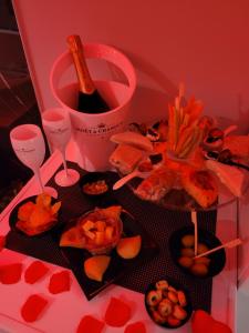 a table with a bunch of food and wine glasses at Raggio di sole in Bari