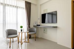 TV a/nebo společenská místnost v ubytování Mini House B&B