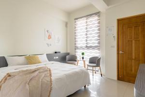 Postel nebo postele na pokoji v ubytování Mini House B&B