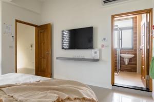 Postel nebo postele na pokoji v ubytování Mini House B&B