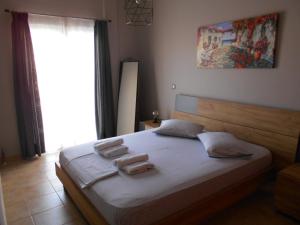 Postel nebo postele na pokoji v ubytování SPΛCES PYLOS Apartments