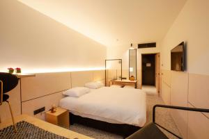 Letto o letti in una camera di Hotel The Lodge Heverlee