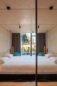 Letto o letti in una camera di Hotel The Lodge Heverlee