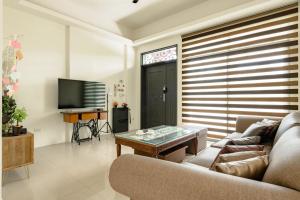TV a/nebo společenská místnost v ubytování Mini House B&B