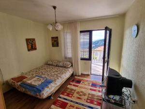 Un ou plusieurs lits dans un hébergement de l'établissement Дом для семейного отдыха в Утехе, Черногория