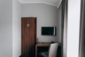 TV a/nebo společenská místnost v ubytování Hotel 4x4
