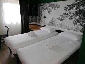 The Originals City Hôtel Bordeaux Porte du Bassin客房内的一张或多张床位