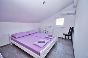 Postel nebo postele na pokoji v ubytování Apartman ZORKA
