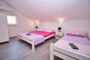 Postel nebo postele na pokoji v ubytování Apartman ZORKA
