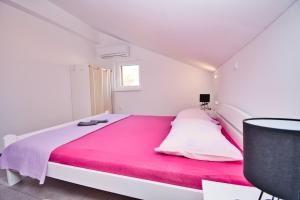 Postel nebo postele na pokoji v ubytování Apartman ZORKA