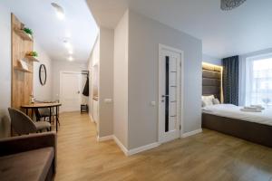 Postel nebo postele na pokoji v ubytování Residente Centr Apart-Hotel
