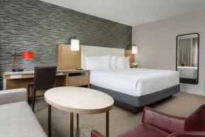 a hotel room with a bed and a desk at Hyatt Regency Bethesda near Washington D.C. in Bethesda