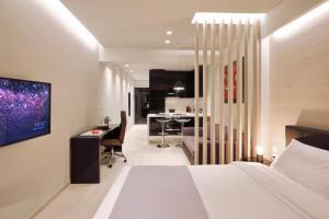 TV a/nebo společenská místnost v ubytování Segundo Molo Suites