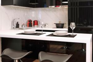 Kuchyň nebo kuchyňský kout v ubytování Segundo Molo Suites