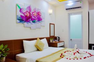 Postel nebo postele na pokoji v ubytování Phuc Con Son Hotel