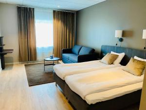 Letto o letti in una camera di Quality Hotel Vänersborg