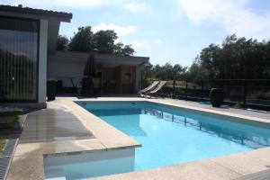 a swimming pool in the backyard of a house at Quinta dos Lagos in Marco de Canaveses