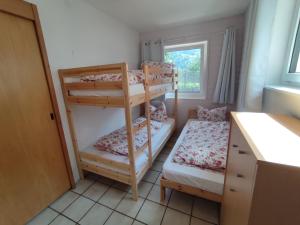 Postel nebo postele na pokoji v ubytování Haus AlpenHahn