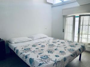 Een bed of bedden in een kamer bij Appartamenti Villa Renata