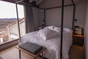 Łóżko lub łóżka w pokoju w obiekcie Vallivana Suites