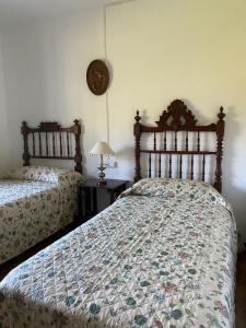 Ліжко або ліжка в номері Casa Rural San Antonio