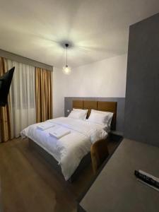 Ένα ή περισσότερα κρεβάτια σε δωμάτιο στο Hotel SH & SH