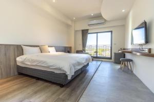 Llit o llits en una habitació de 后棧Hou Inn