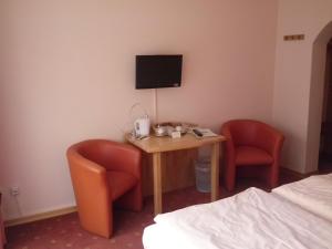 TV a/nebo společenská místnost v ubytování Hotel Garni am Bowenberg