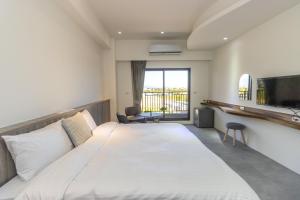 Llit o llits en una habitació de 后棧Hou Inn