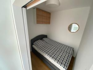 Posteľ alebo postele v izbe v ubytovaní Apartament Bajka