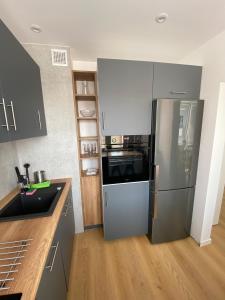 Kuchyňa alebo kuchynka v ubytovaní Apartament Bajka