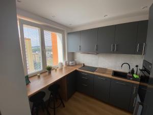 Kuchyňa alebo kuchynka v ubytovaní Apartament Bajka