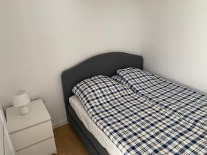 Vuode tai vuoteita majoituspaikassa Apartament Bajka