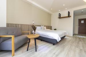 Llit o llits en una habitació de 后棧Hou Inn