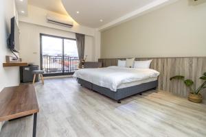 Llit o llits en una habitació de 后棧Hou Inn