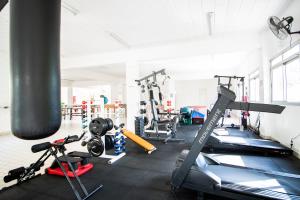 a gym with several treadmills and machines at 3 Quartos, espaçoso, Shopping Raposo in Sao Paulo +28 photos