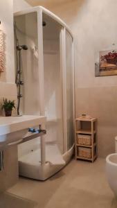 a bathroom with a shower and a sink and a toilet at Casa Marinelli in Farra di Soligo