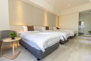 Llit o llits en una habitació de 后棧Hou Inn