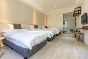 Llit o llits en una habitació de 后棧Hou Inn