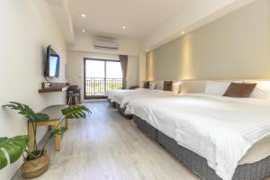 Llit o llits en una habitació de 后棧Hou Inn