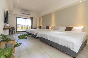 Llit o llits en una habitació de 后棧Hou Inn