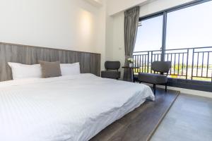 Llit o llits en una habitació de 后棧Hou Inn