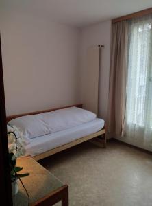 Postel nebo postele na pokoji v ubytování Albergo Faido