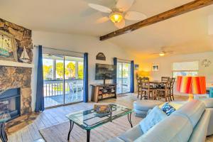 a living room with a couch and a fireplace at Vibrant Island Home with Pool, 1 Block to Beach in Anna Maria